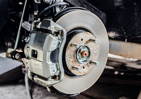 A close up of a brake disc on a car.