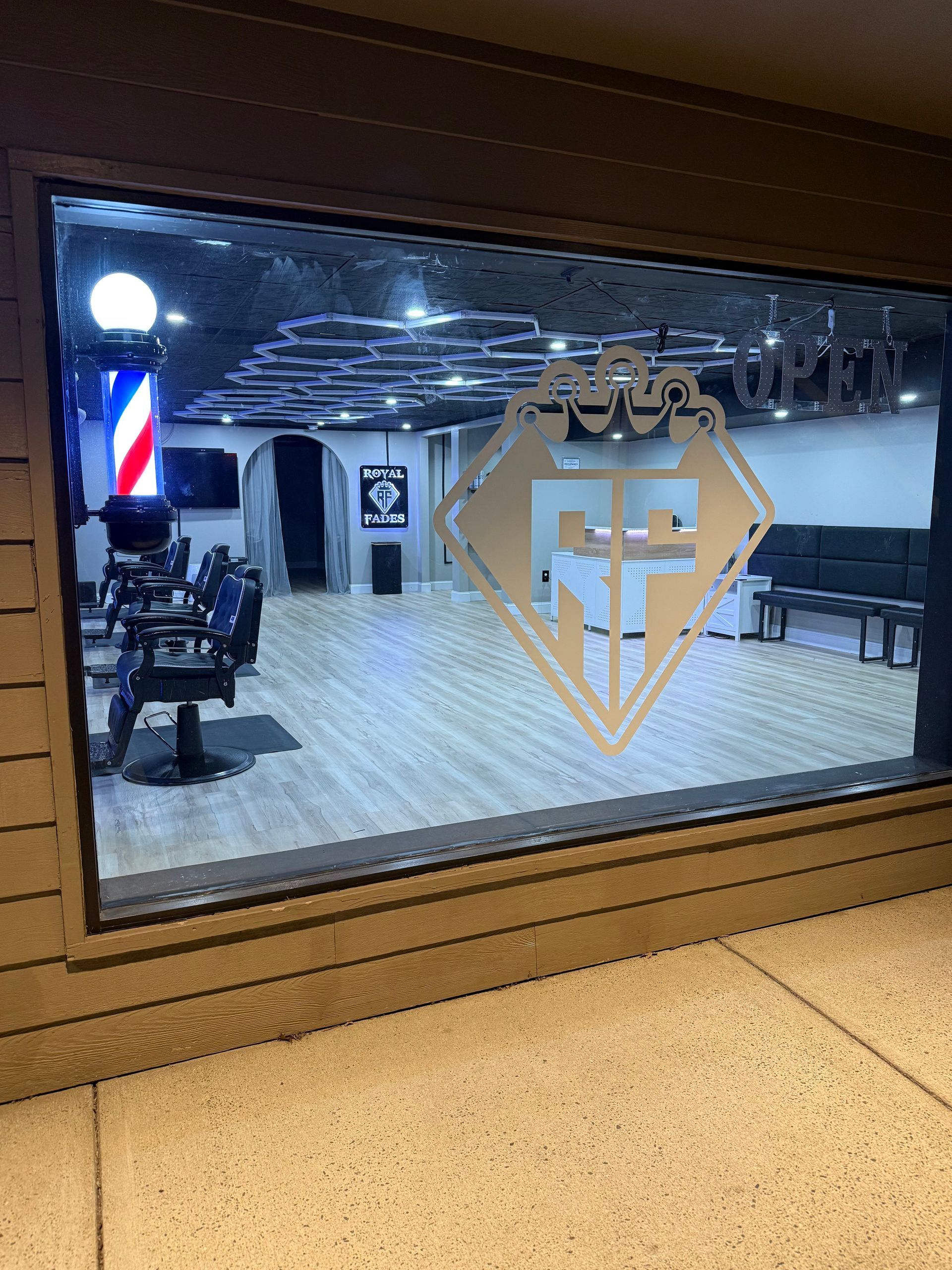 A view of a barber shop through a window.