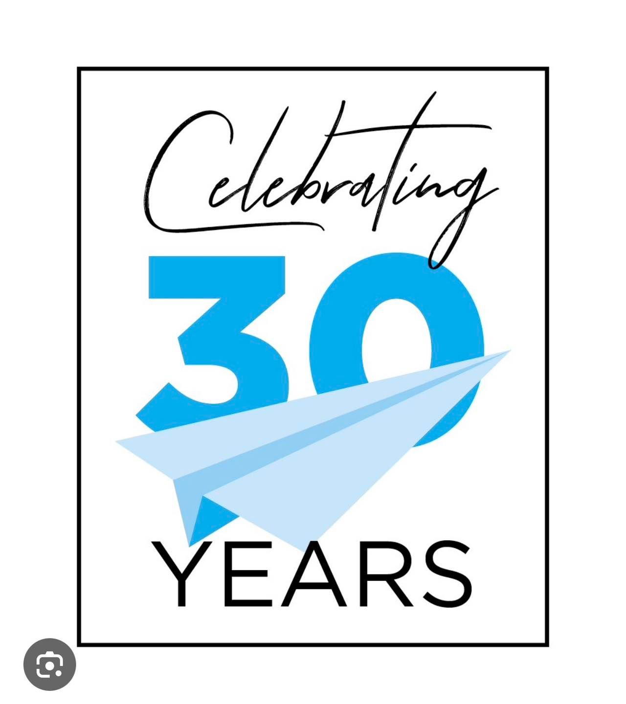 A sign that says celebrating 30 years with a paper airplane