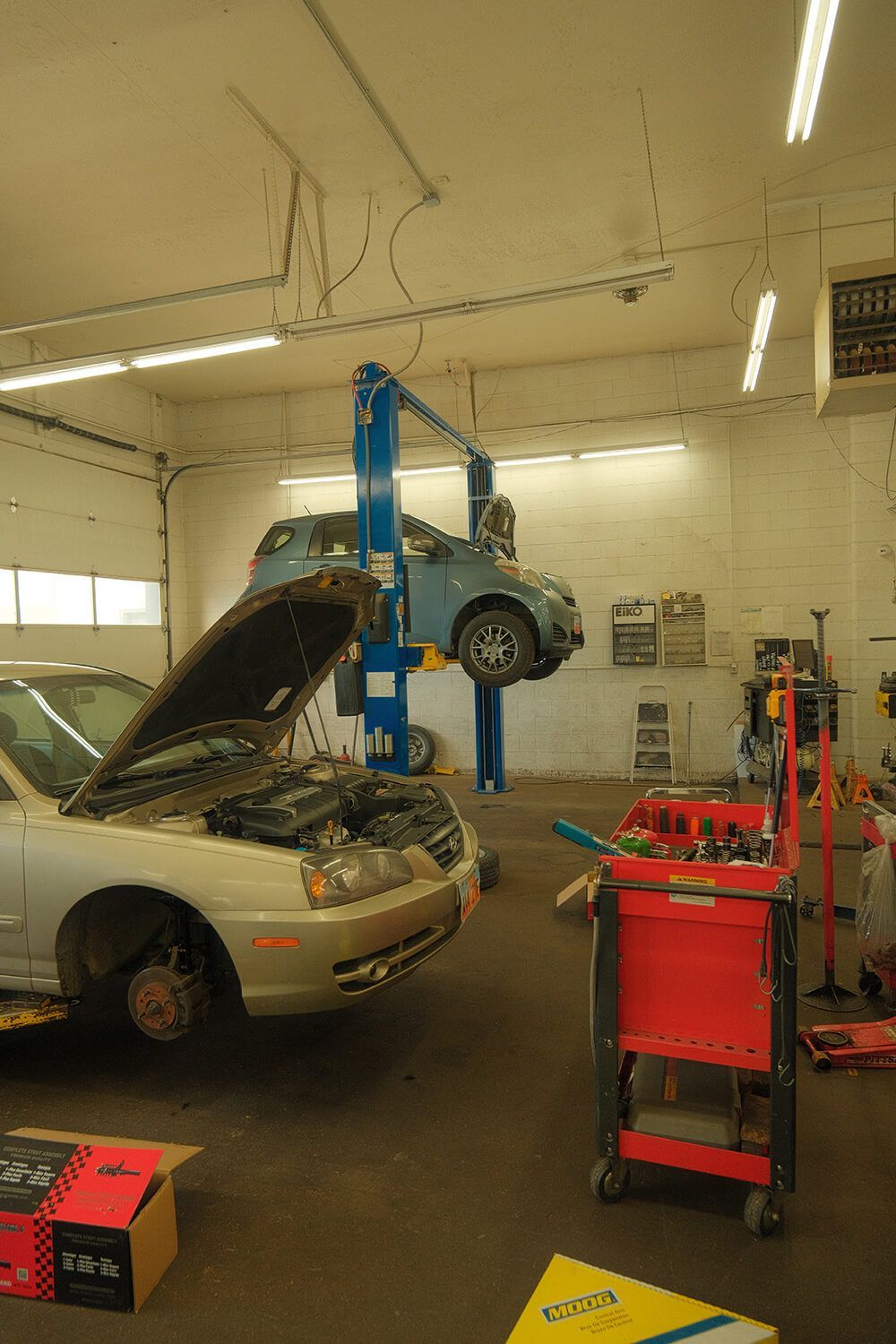 Car with Hood Open in Garage  | Premium Auto - Ogden