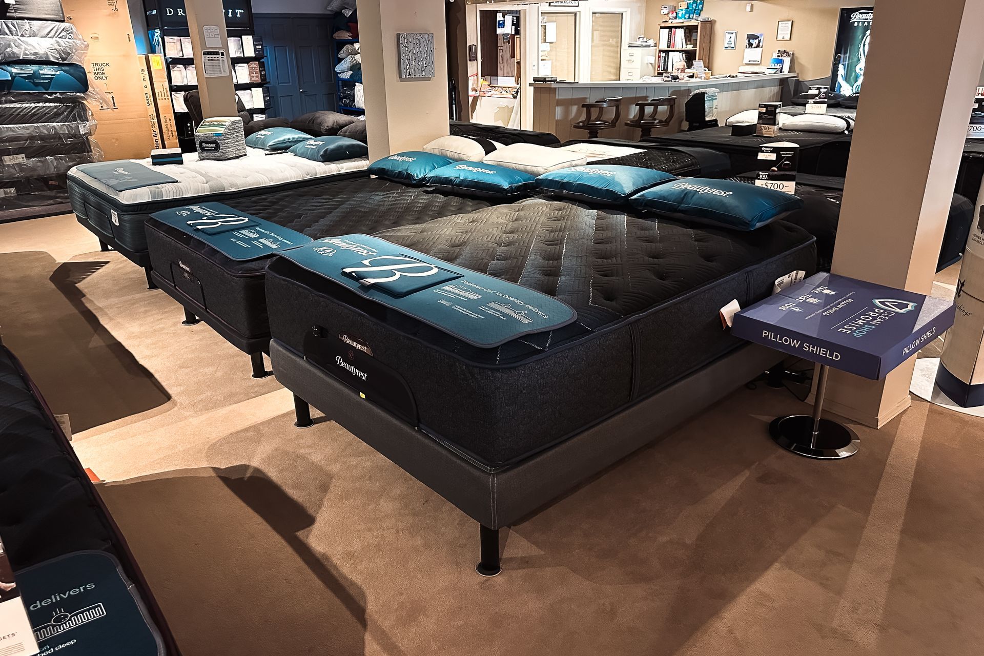 A bed with a mattress and pillows on it.