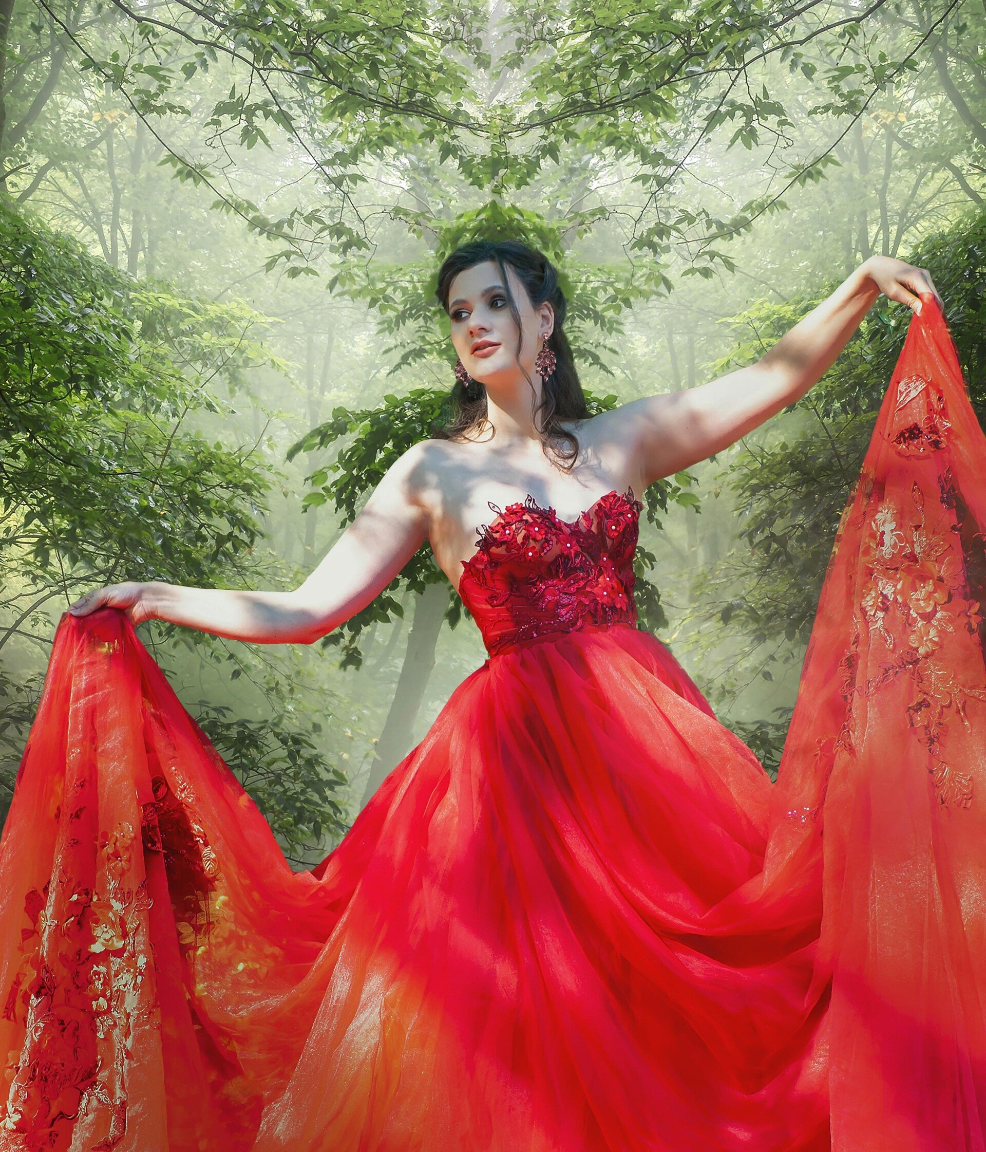 Een vrouw in een rode jurk staat die gaat trouwen is helemaal in de wolken