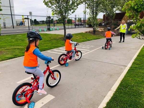 young kids riding bikes