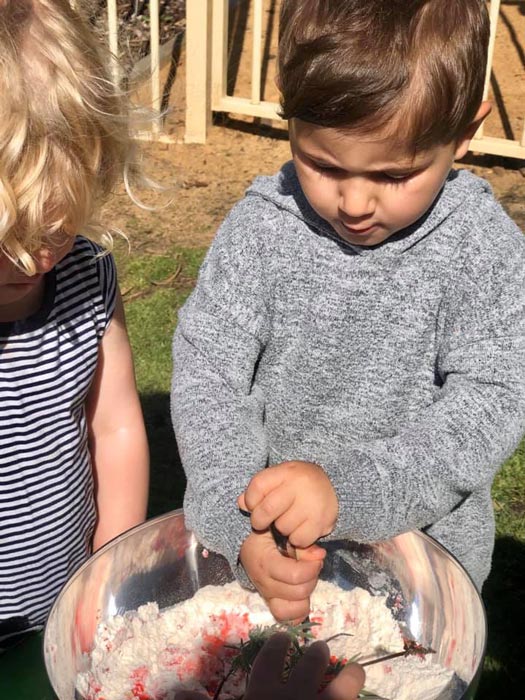 young boy making slime