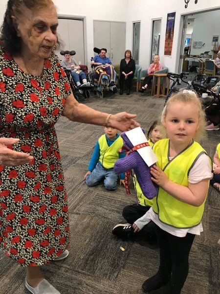 young child with elderly woman