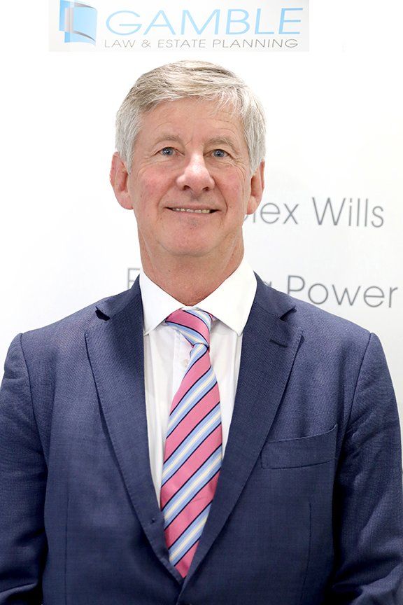 man in a suit smiling