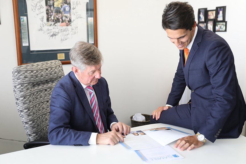 two men looking at a catalog