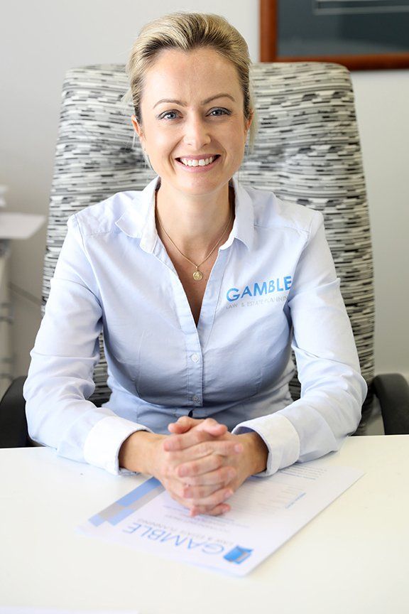 woman smiling while sitting