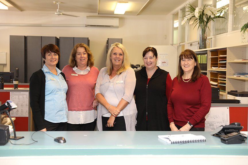 group of women posing for a photo