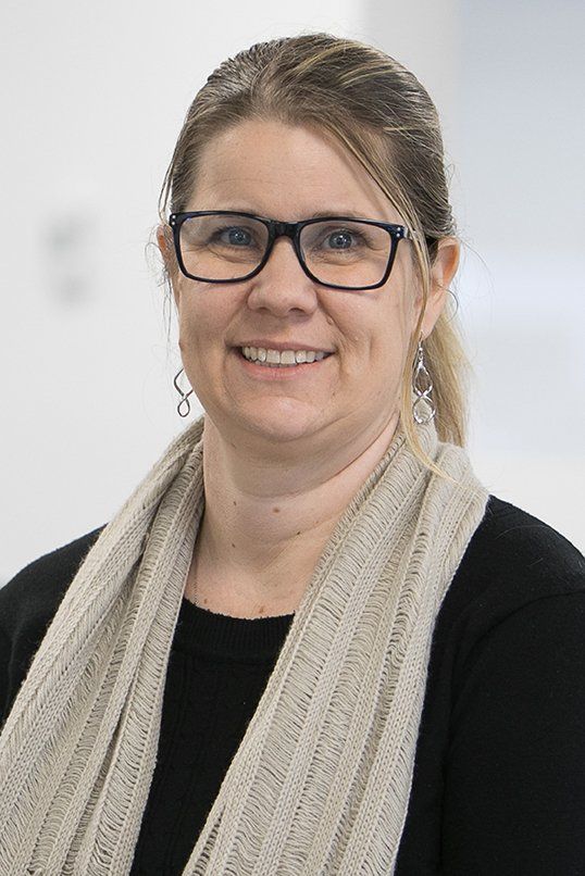 woman wearing a scarf smiling