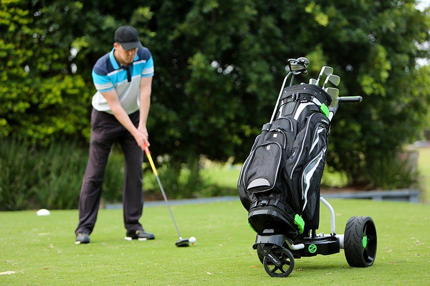 golf bag and man playing golf