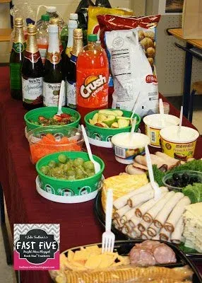 A table topped with a variety of food and drinks.