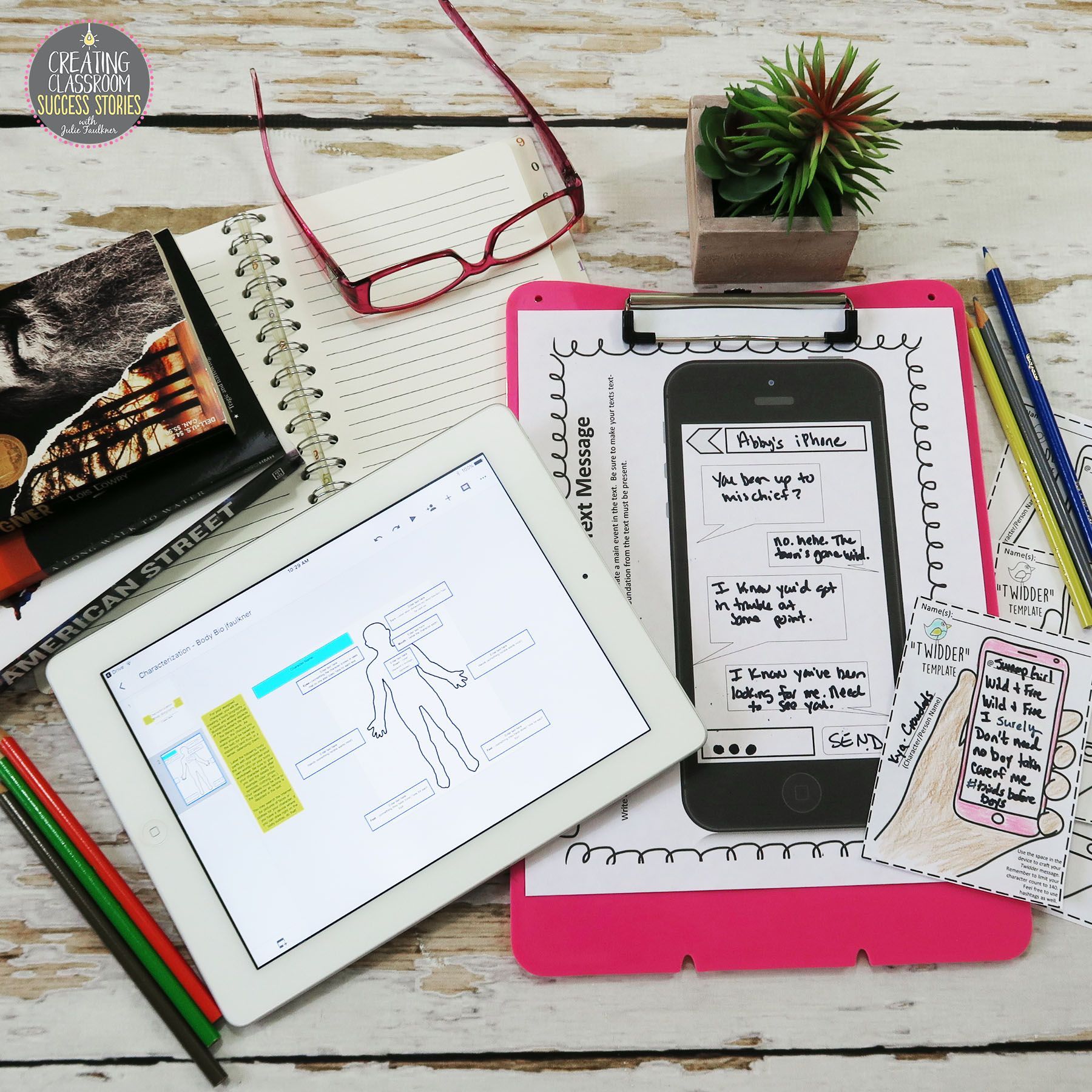 A tablet is sitting on a clipboard next to a cell phone