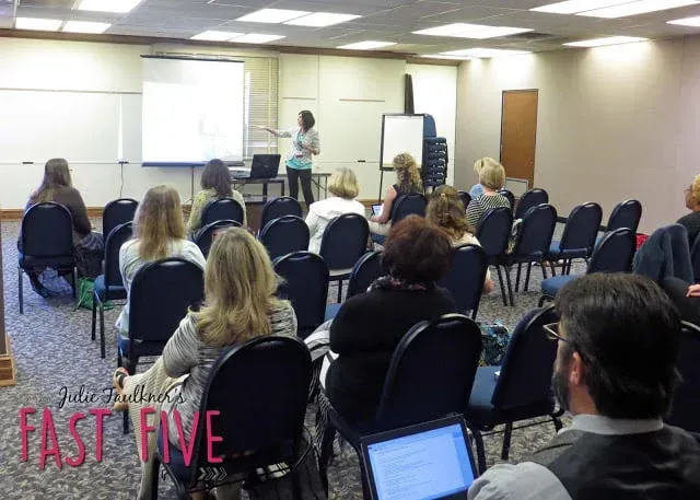 A group of people are sitting in a room with the word fast five on the bottom