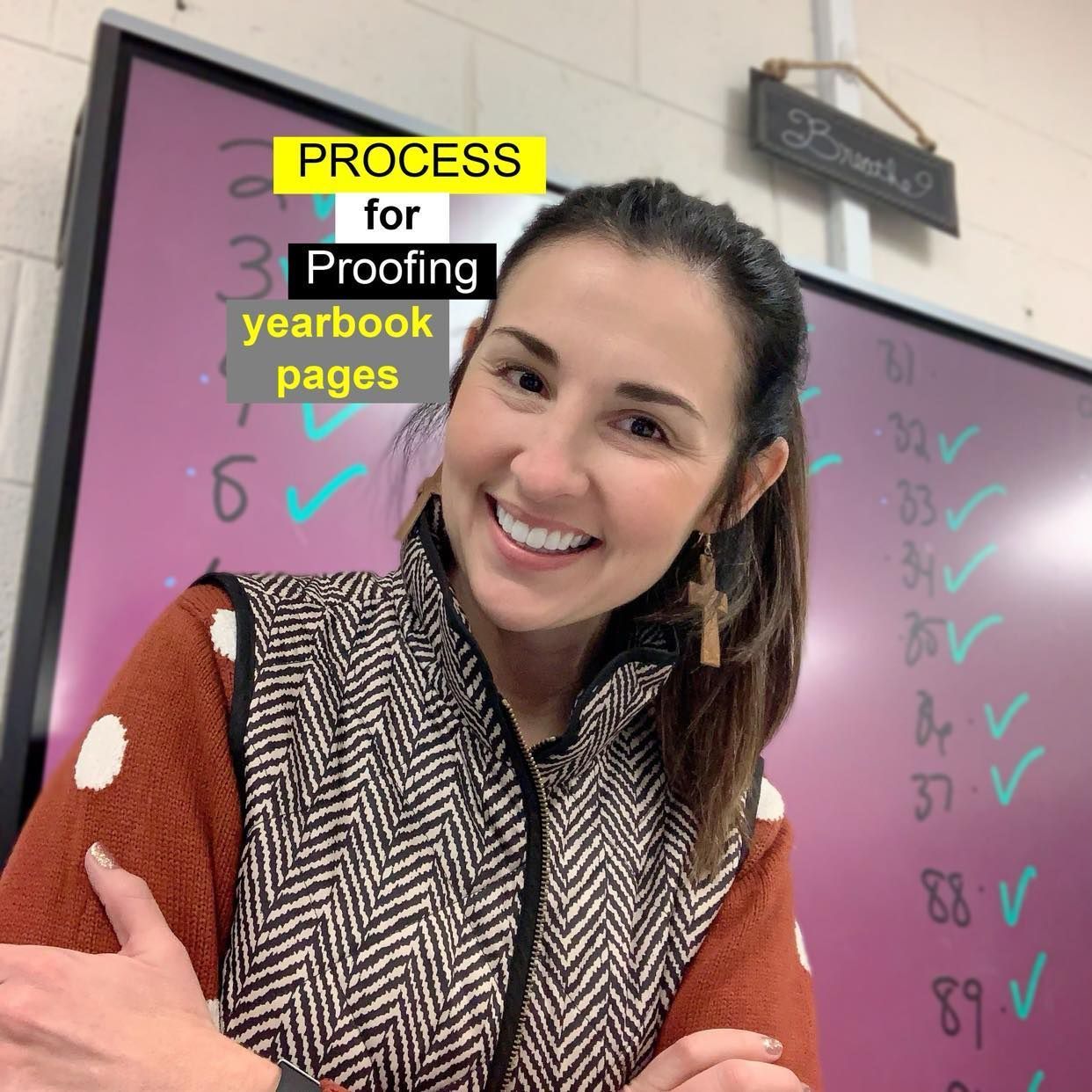A woman is smiling in front of a board that says process for proofing yearbook pages