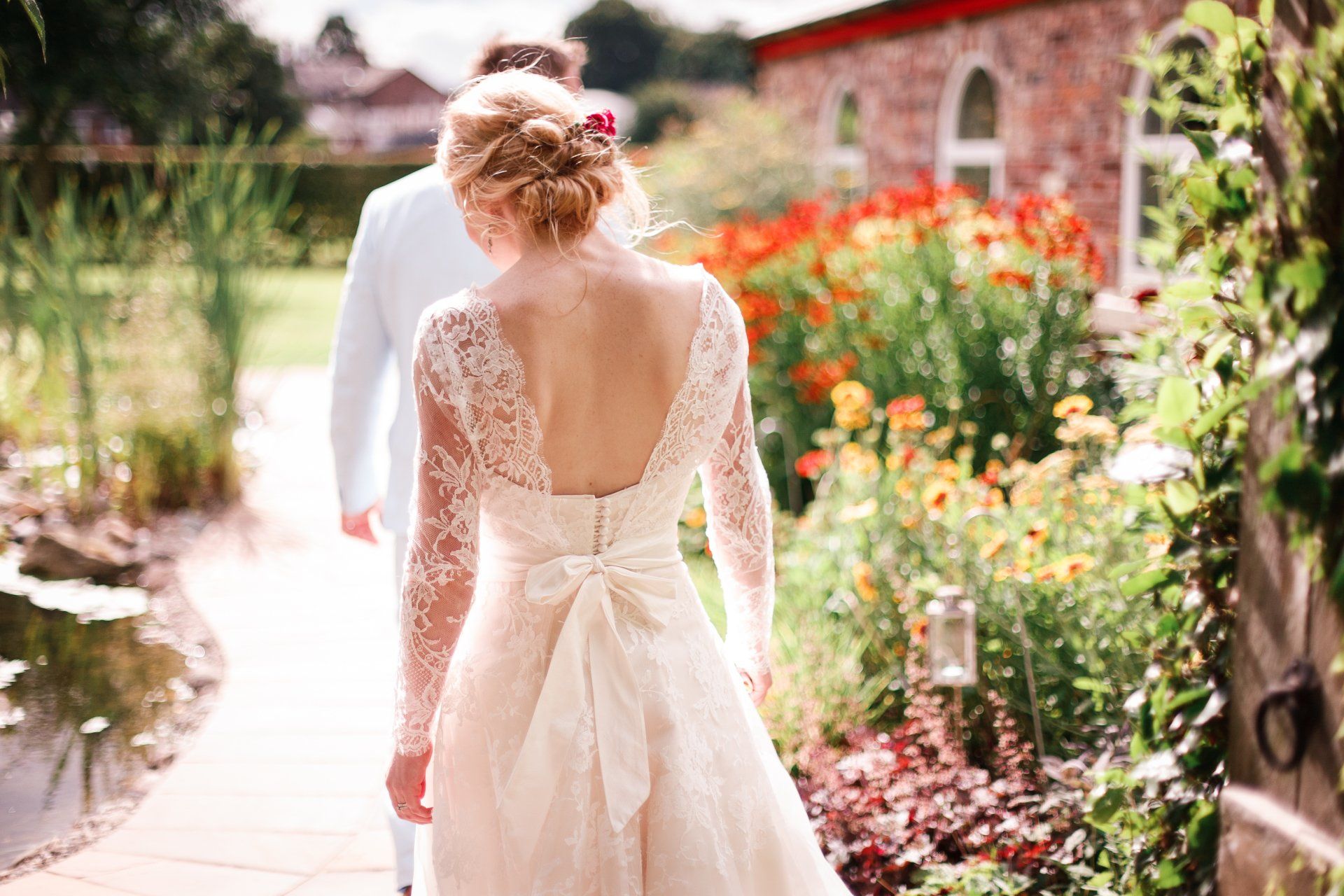 bride walks in garden flowers romantic garden  wedding