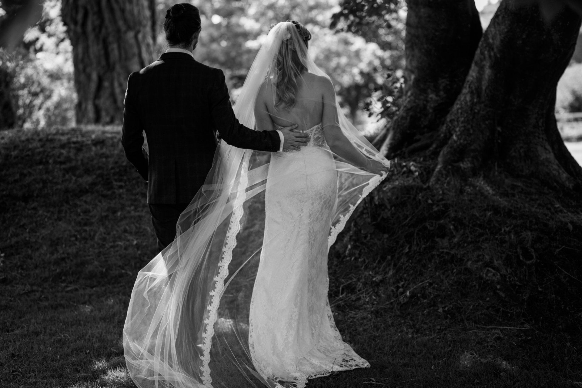 Truro registration office wedding photos couple walking in garden