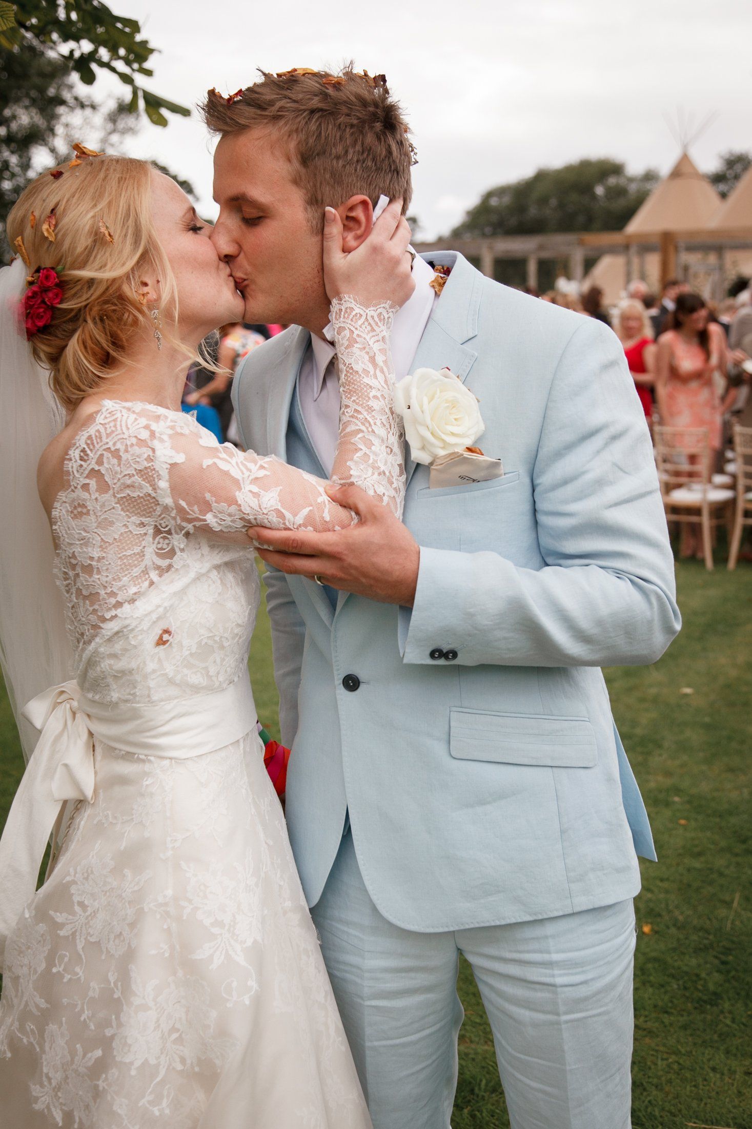 Garden wedding bride kisses groom after ceremony