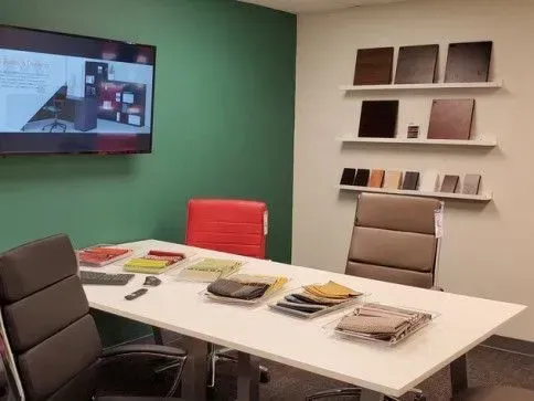 Workspace table with samples and design boards on display