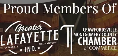 A sign that says proud members of greater lafayette and crawfordsville montgomery county chamber of commerce