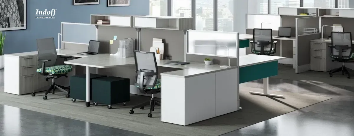 A large office with a lot of desks and chairs.