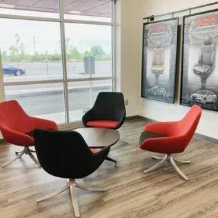 There are four chairs and a table in the room.