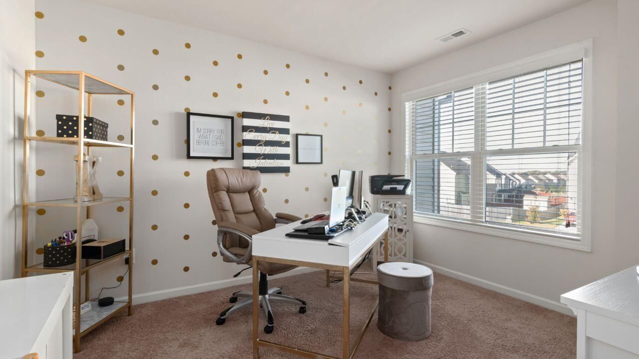 Stylish home office  with a desk, chair, and shelves.