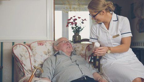 A doctor assisting the elderly