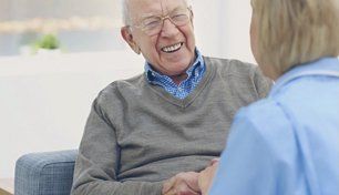 A smiling elderly person