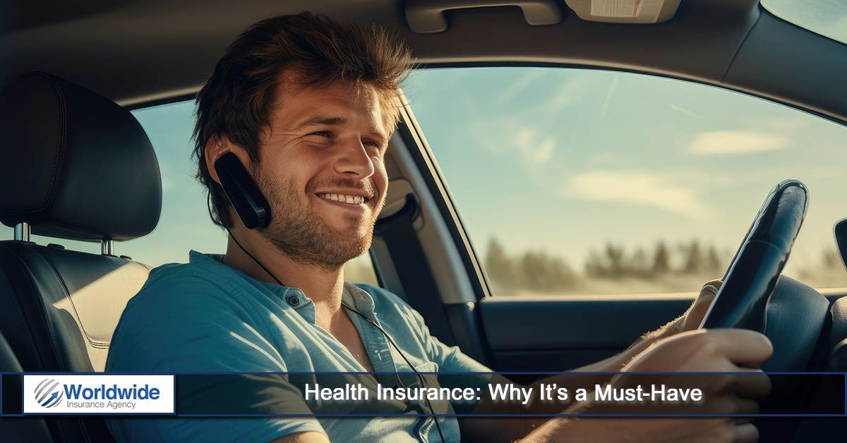 A man is talking on a cell phone while driving a car.