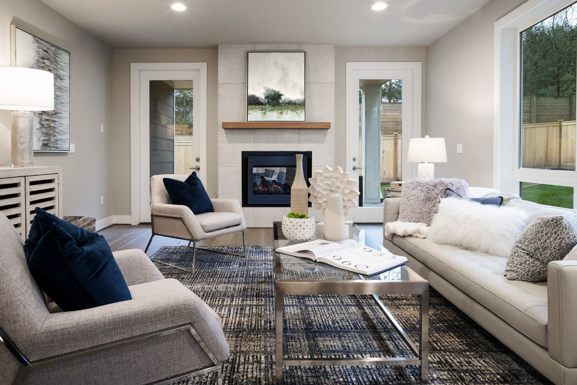 Living room with gray furniture, fireplace, and blue accents.
