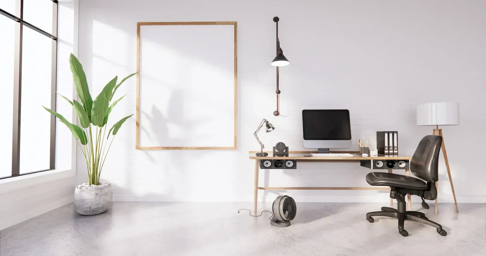 Modern office space with desk, chair, monitor, lamp, blank art, and potted plant.