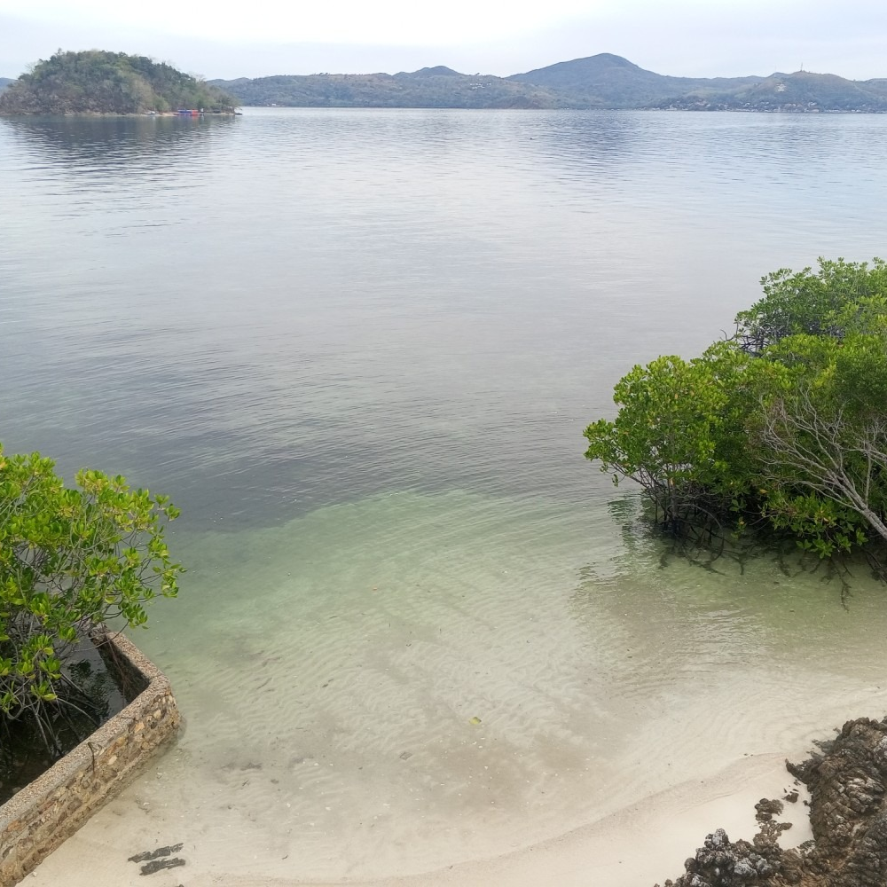 There is a small island in the middle of the ocean.