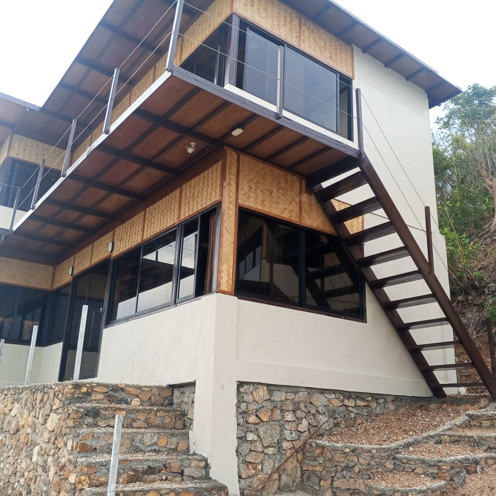 A house with stairs leading up to the second floor