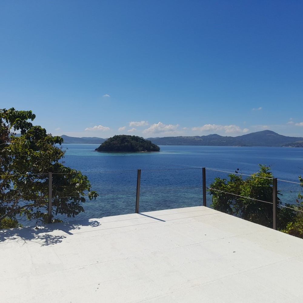 A view of a body of water with a small island in the distance
