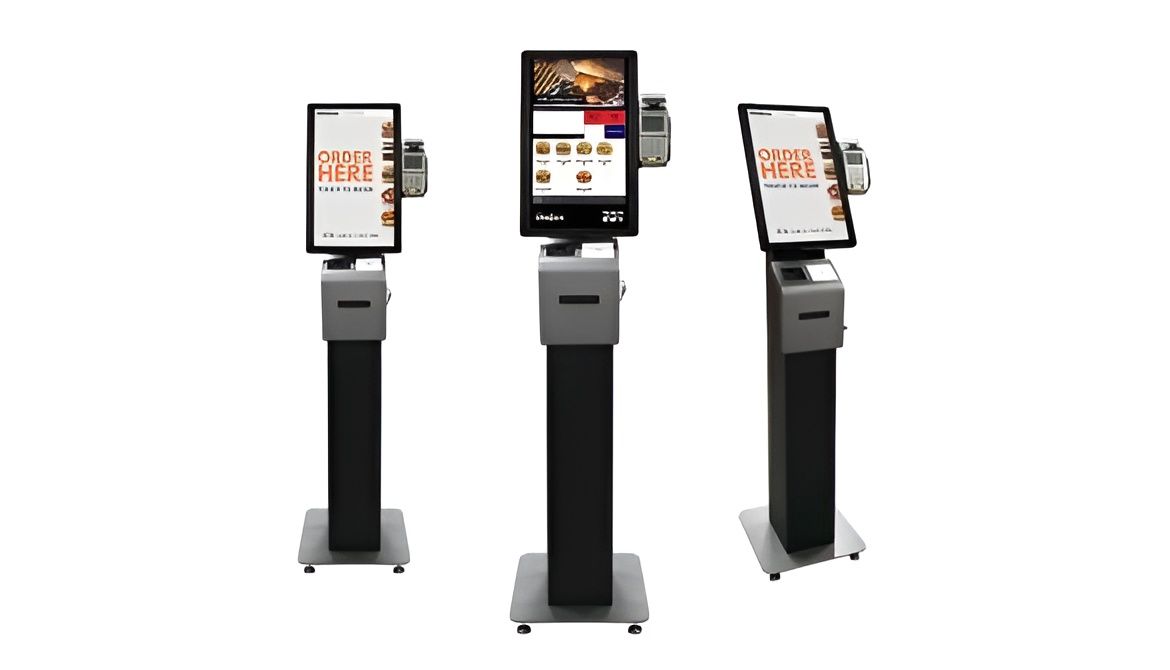 Three freestanding touchscreen kiosks for ordering food. Each has a tablet display, payment terminal, and receipt printer — Coastal Registers & POS In Tweed Heads, NSW