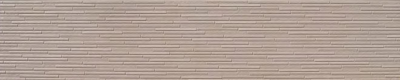 A close up of a brick wall with a striped pattern.