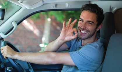 A woman is talking on a cell phone while holding a tablet.