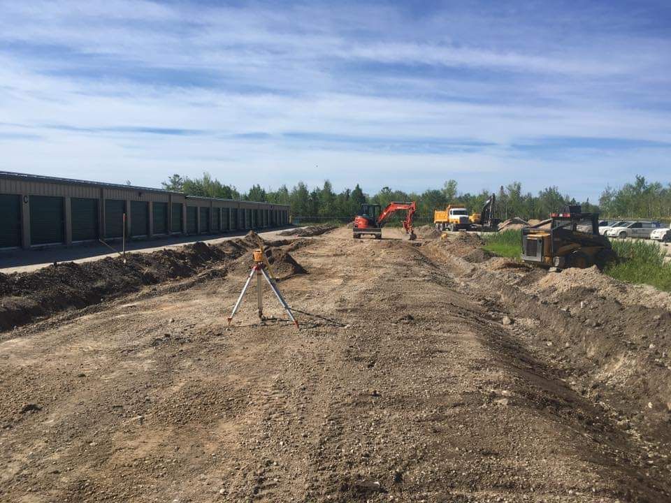A construction site with a lot of dirt and machinery.