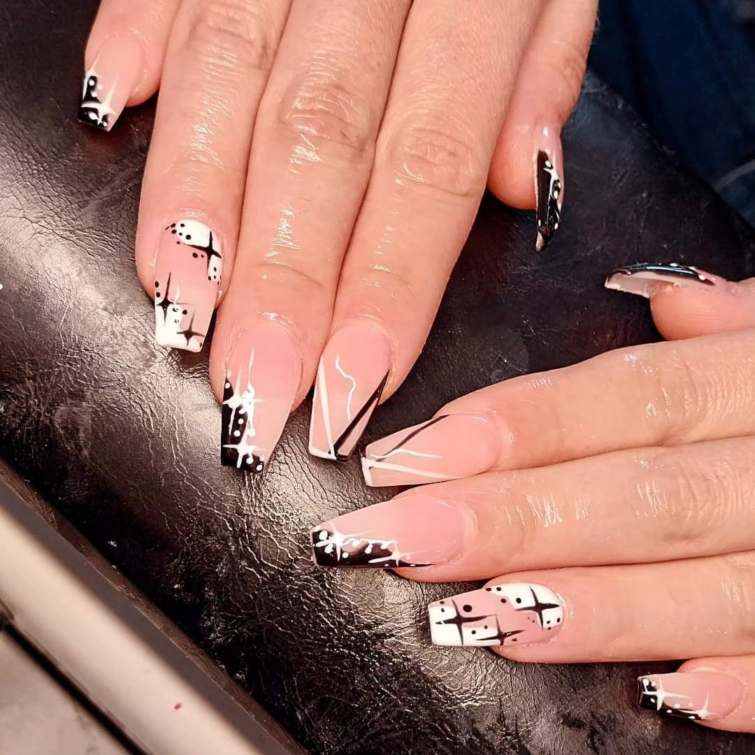 Hard gel nail extensions with black and white stars