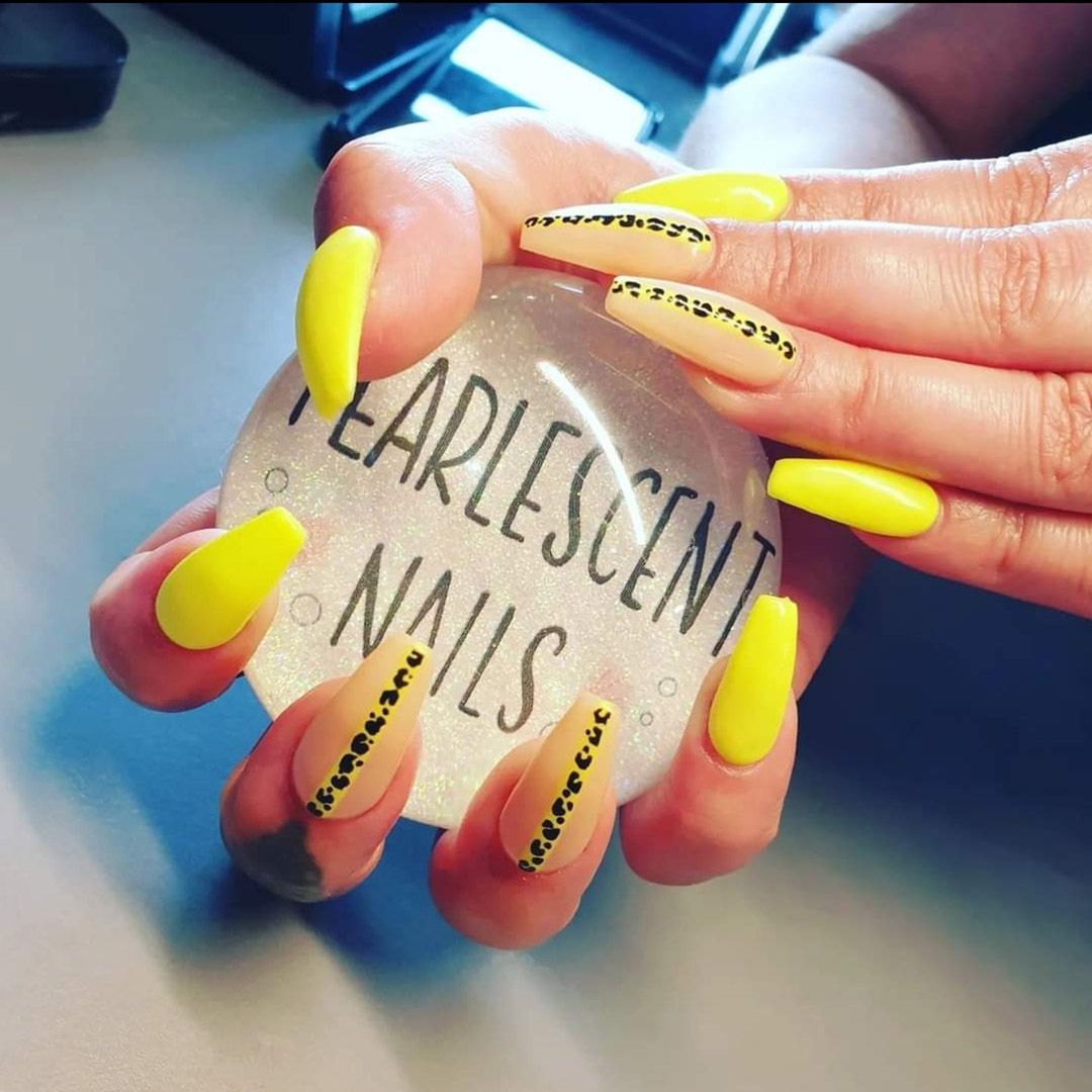 Glow in the dark gel nail extensions in yellow with leopard print design