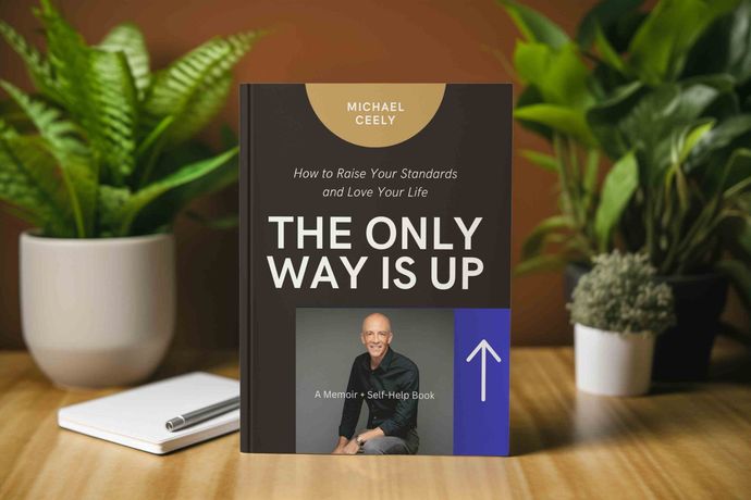 A book on a wooden table titled The Only Way Is Up