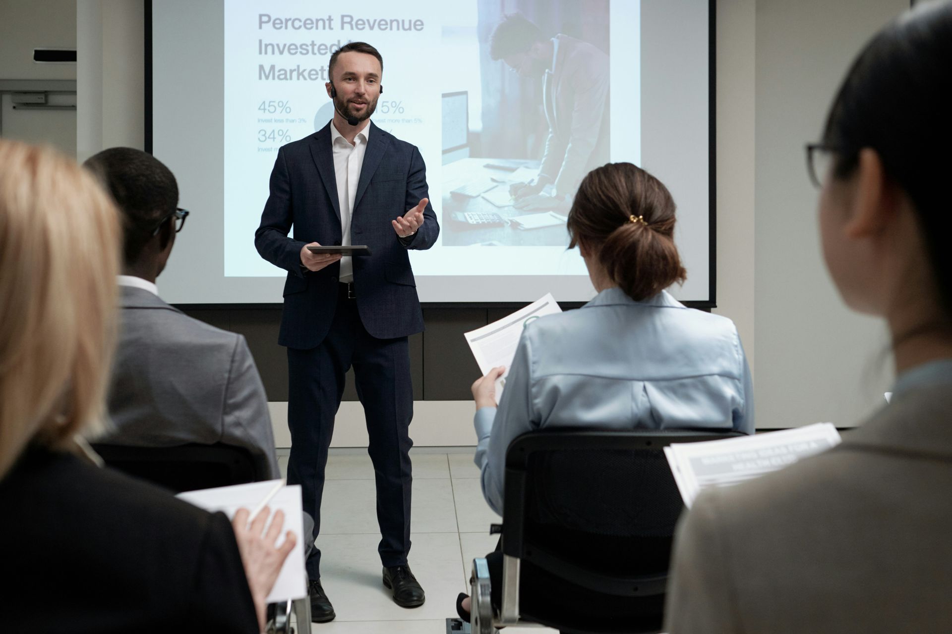 An entrepreneur is giving a presentation to a group of people.