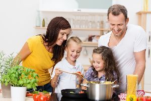 A happy family while cooking — Anchorage, AK — Accel Fire Systems, Inc.