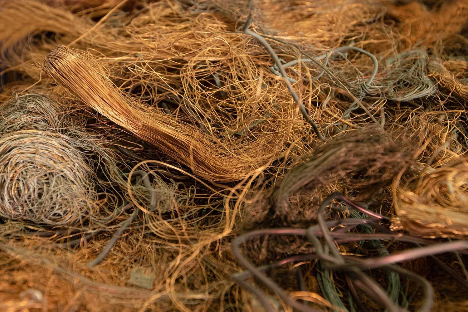 A close-up of tangled copper and other wires.