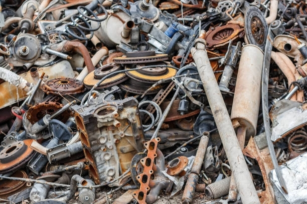 Background pile of rusted metal scrap in open air for metal recycling services at Bryant Industries