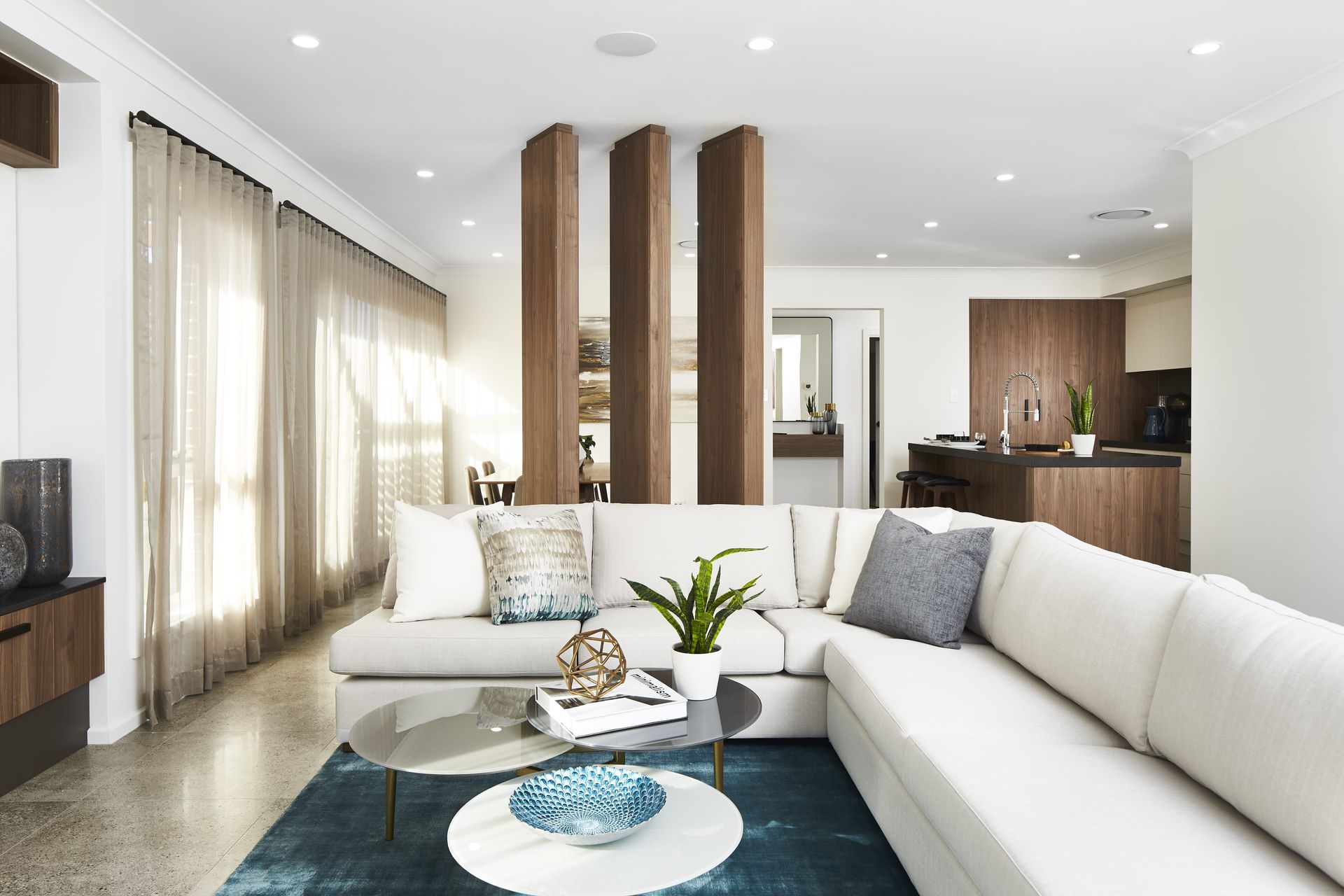 Refuge 25 home design - A living room with a couch and a coffee table.