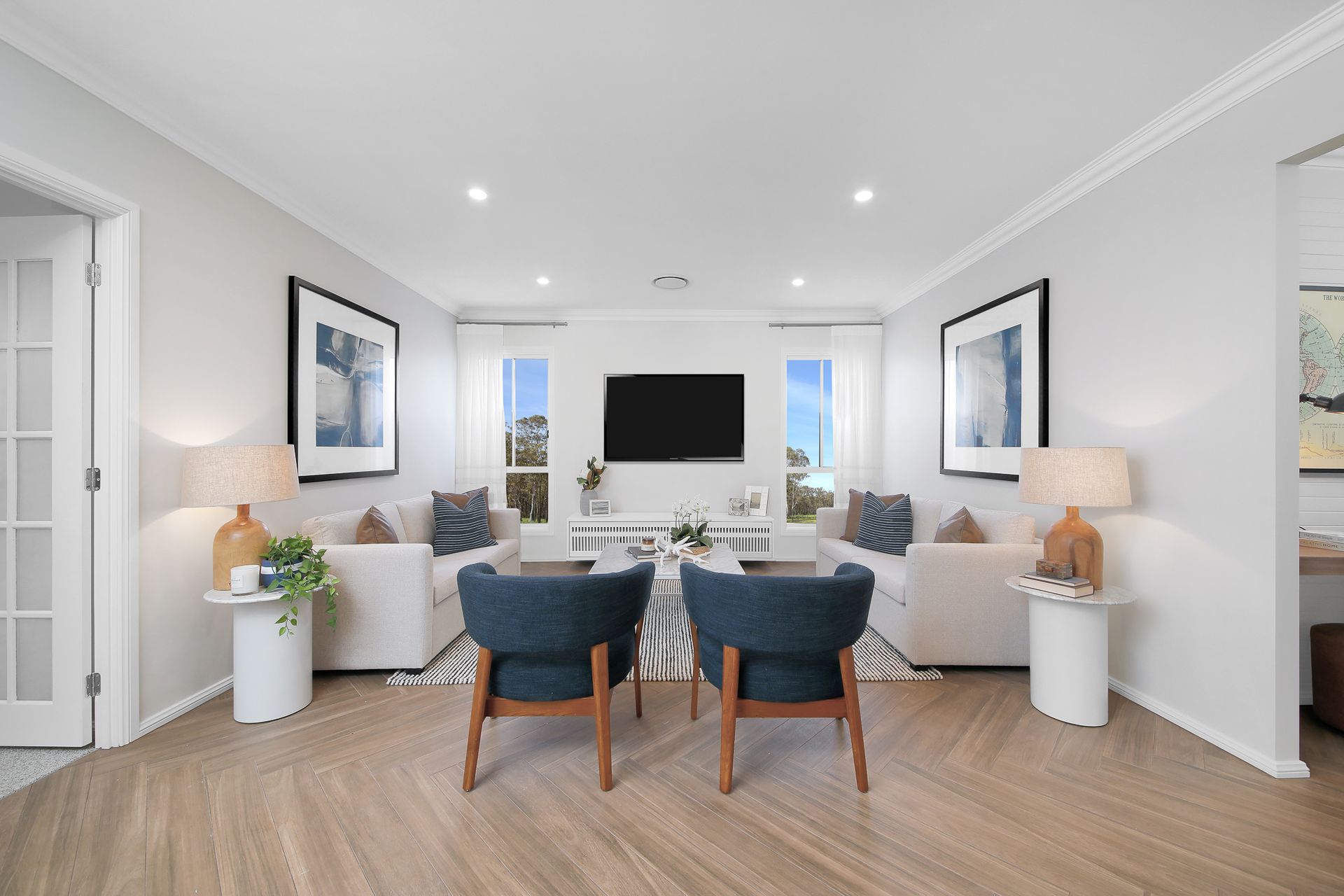 Villa 24 home design - A living room filled with furniture and a flat screen tv.