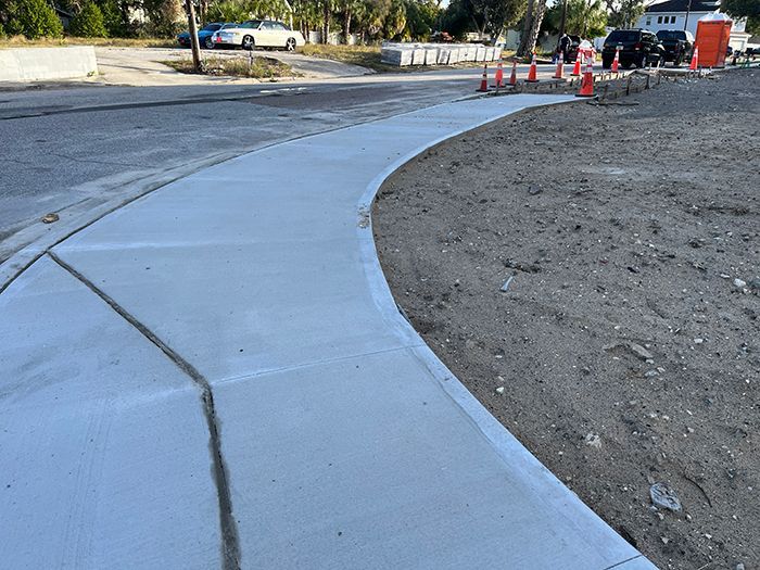 newly constructed curved sidewalk on a residential property