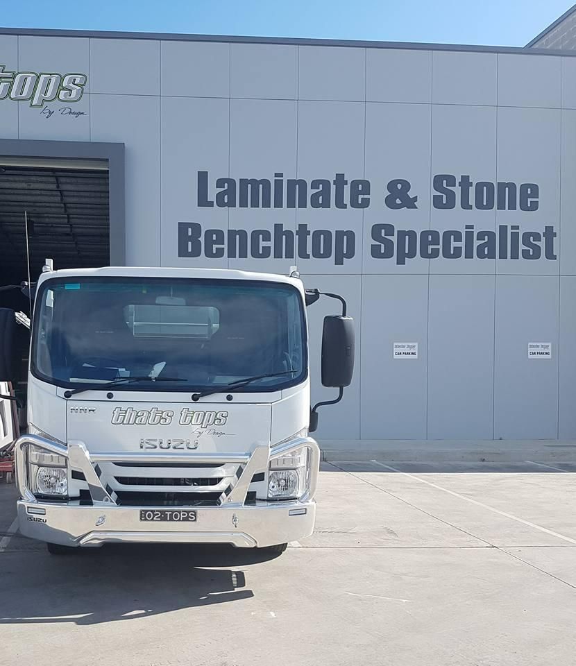 A White Truck Is Parked in Front of A Building — Thats Tops by Design in Taminda, NSW